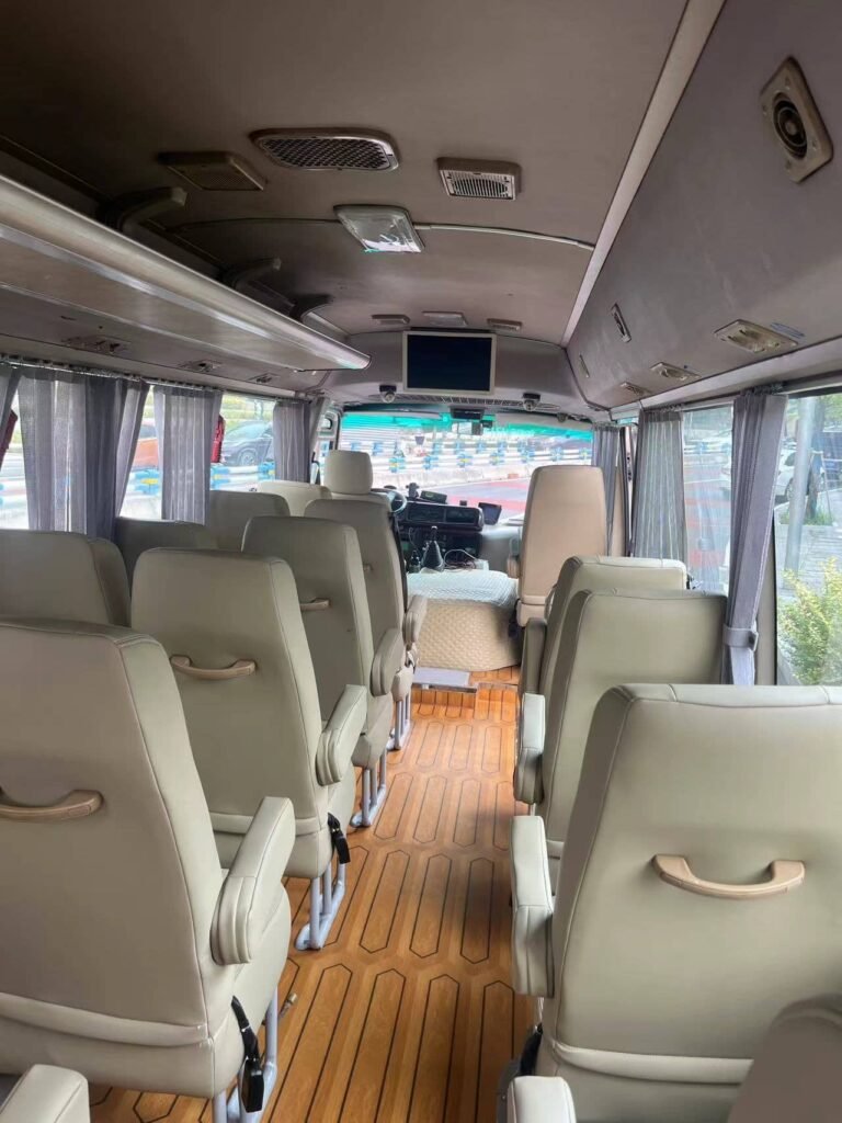 Comfortable seats inside a 22-seater Chongqing private minibus